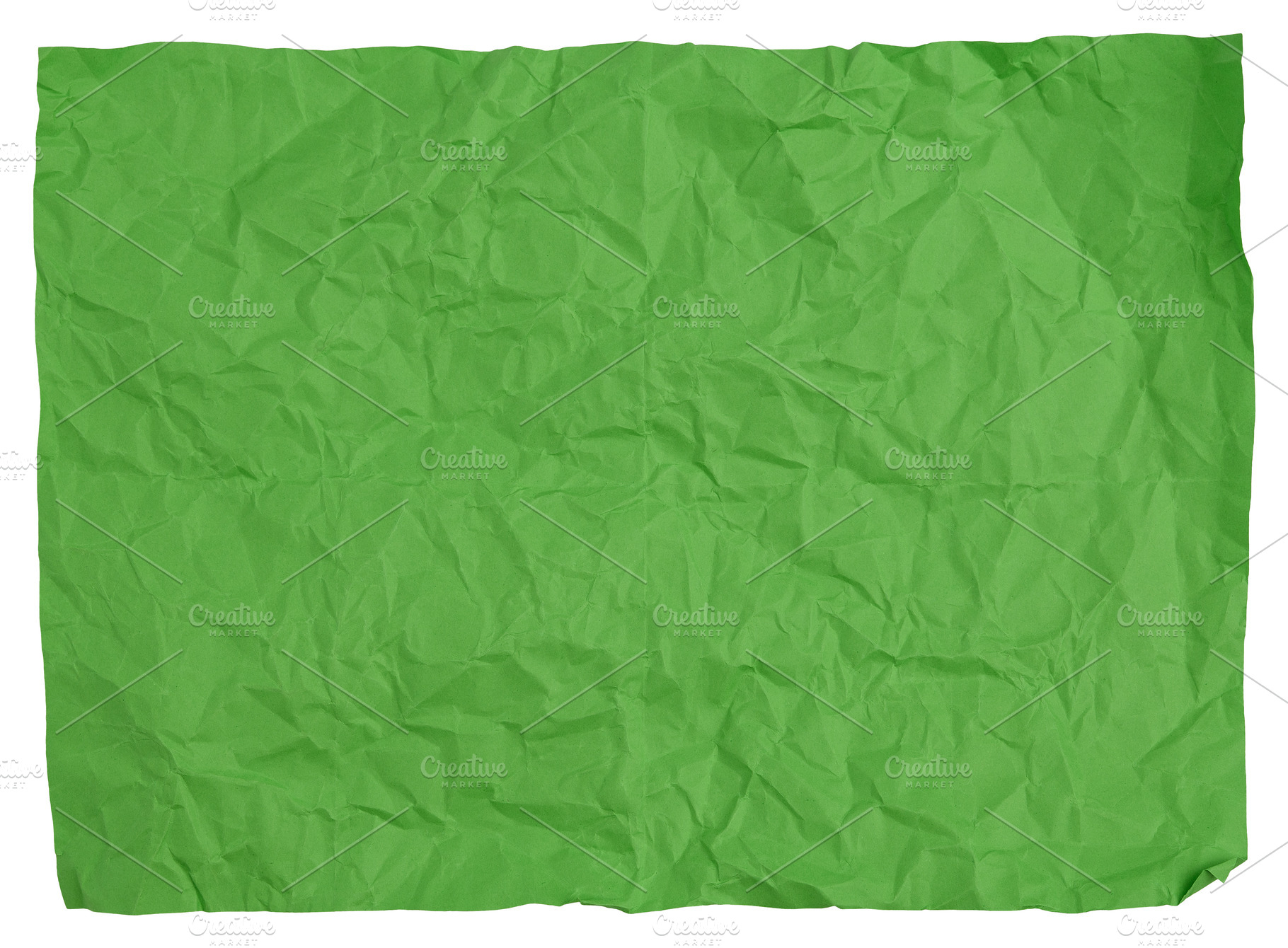 Crumpled green sheet of paper on isolated background, a Background Photo by ndanko