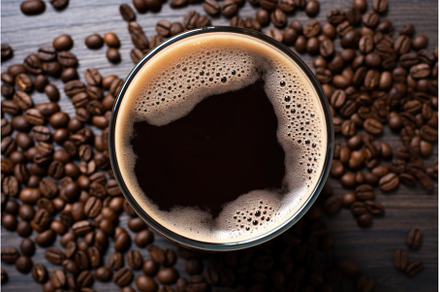 top view of a pint of dark stout, a Food & Drink Photo by Sergey Kotenev