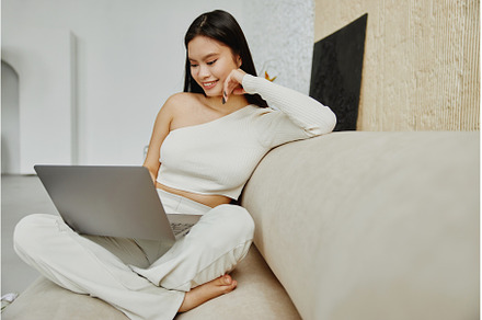 Attractive asian woman using laptop