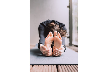 Young woman doing yoga, a School & Education Photo by MAnuta