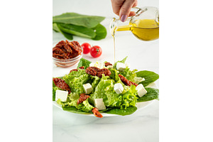 Salad of sun-dried tomatoes, cheese, a Food & Drink Photo by Fascinadora