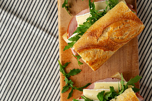 Homemade French Ham and Brie Baguette with Arugula Greens, top v, a Food & Drink Photo by LiudmylaChuhunova