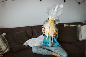 Boy holding huge Easter egg in front, a Holiday Photo by HalfPoint