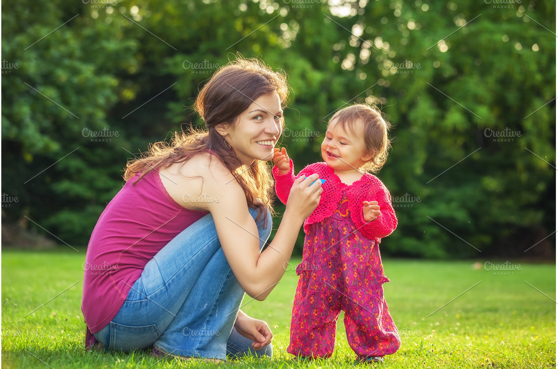 Mother with baby in the park, a Person Photo by sborisov