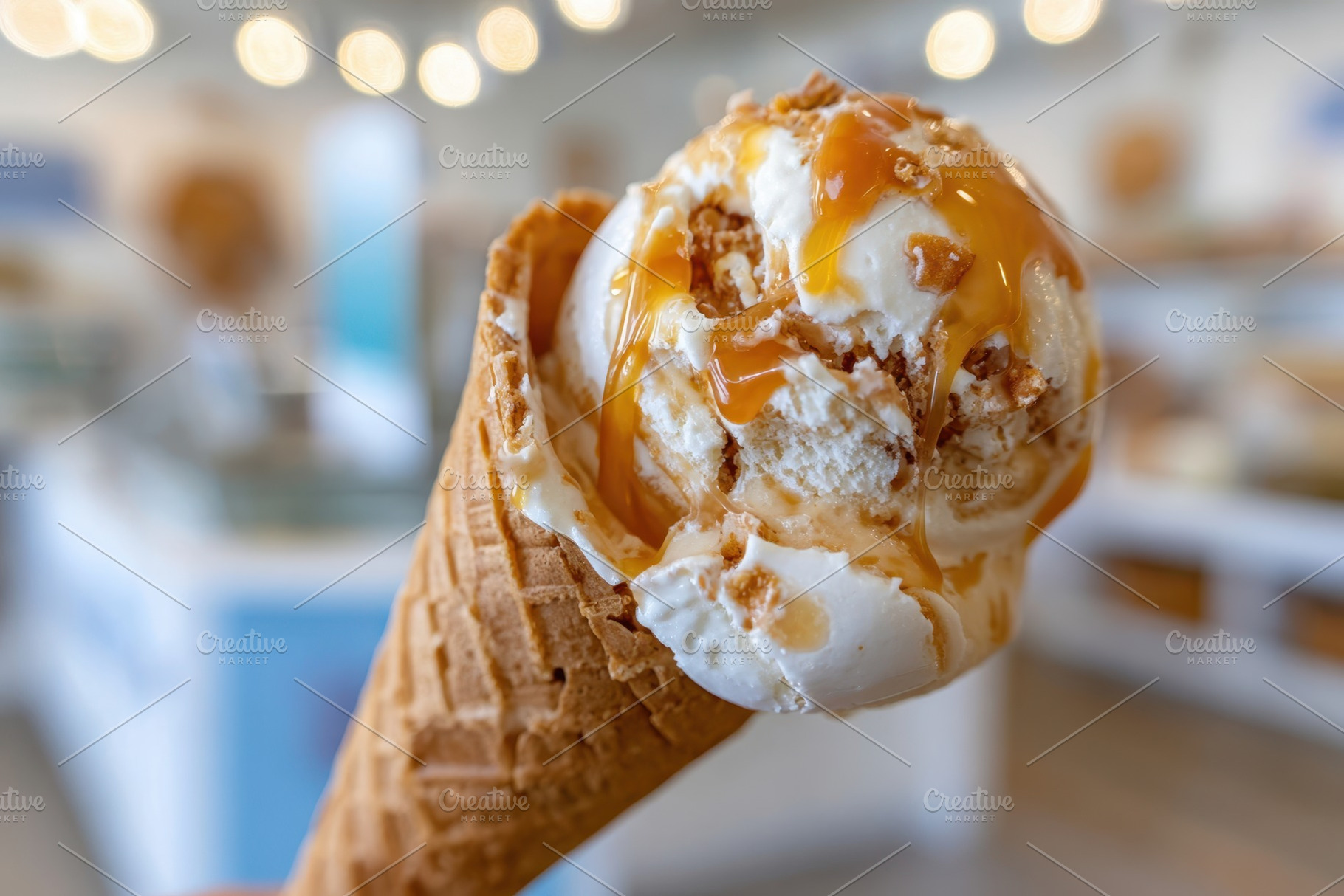 Ice cream cone with caramel drizzle, a Food & Drink Photo by AlyaAnd