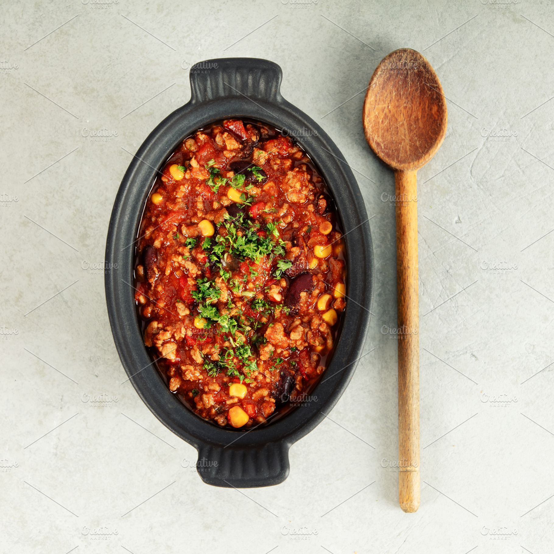 Mexican Chili with Corn Chips and Wooden Spoon on Light Backgrou, a Food & Drink Photo by Natalia Klenova's Shop