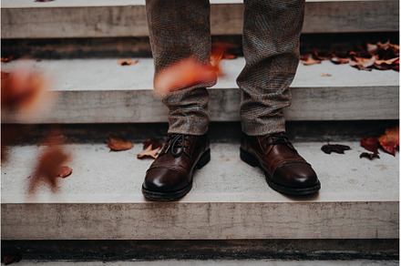 Close-up of mens legs at city, a Person Photo by HalfPoint