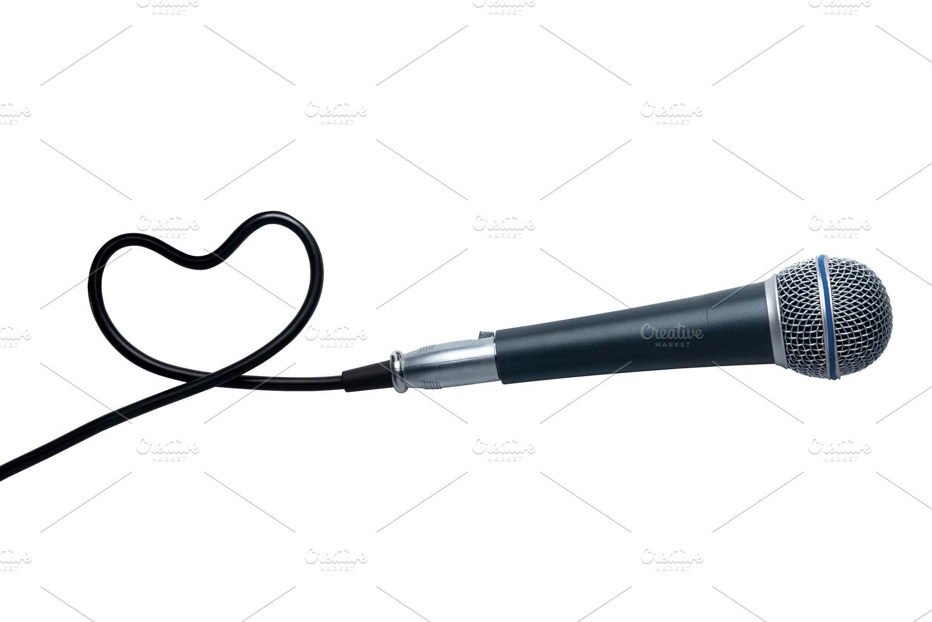 Black microphone with cord forming a heart shape on a white back, a Holiday Photo by Ales Munt