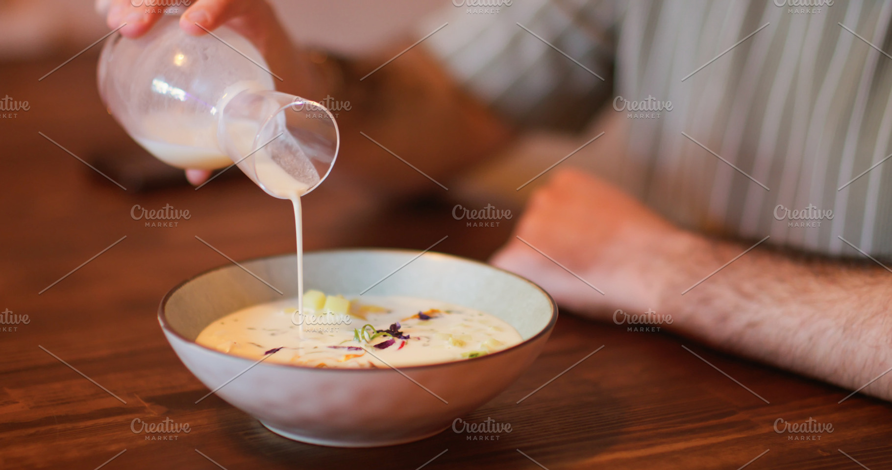 Pouring food cold soup vegetable bowl meal man, a Food & Drink Photo by Photo Drive Studio