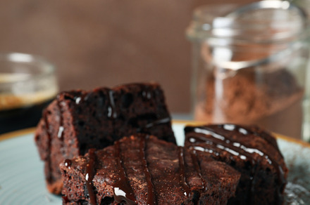 Composition with chocolate cake slices on white wood background,, a Food & Drink Photo by AtlasStudio
