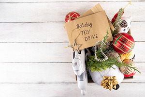 Tradition holiday toys drive, cardboard box full with with kids, a Holiday Photo by Rimma