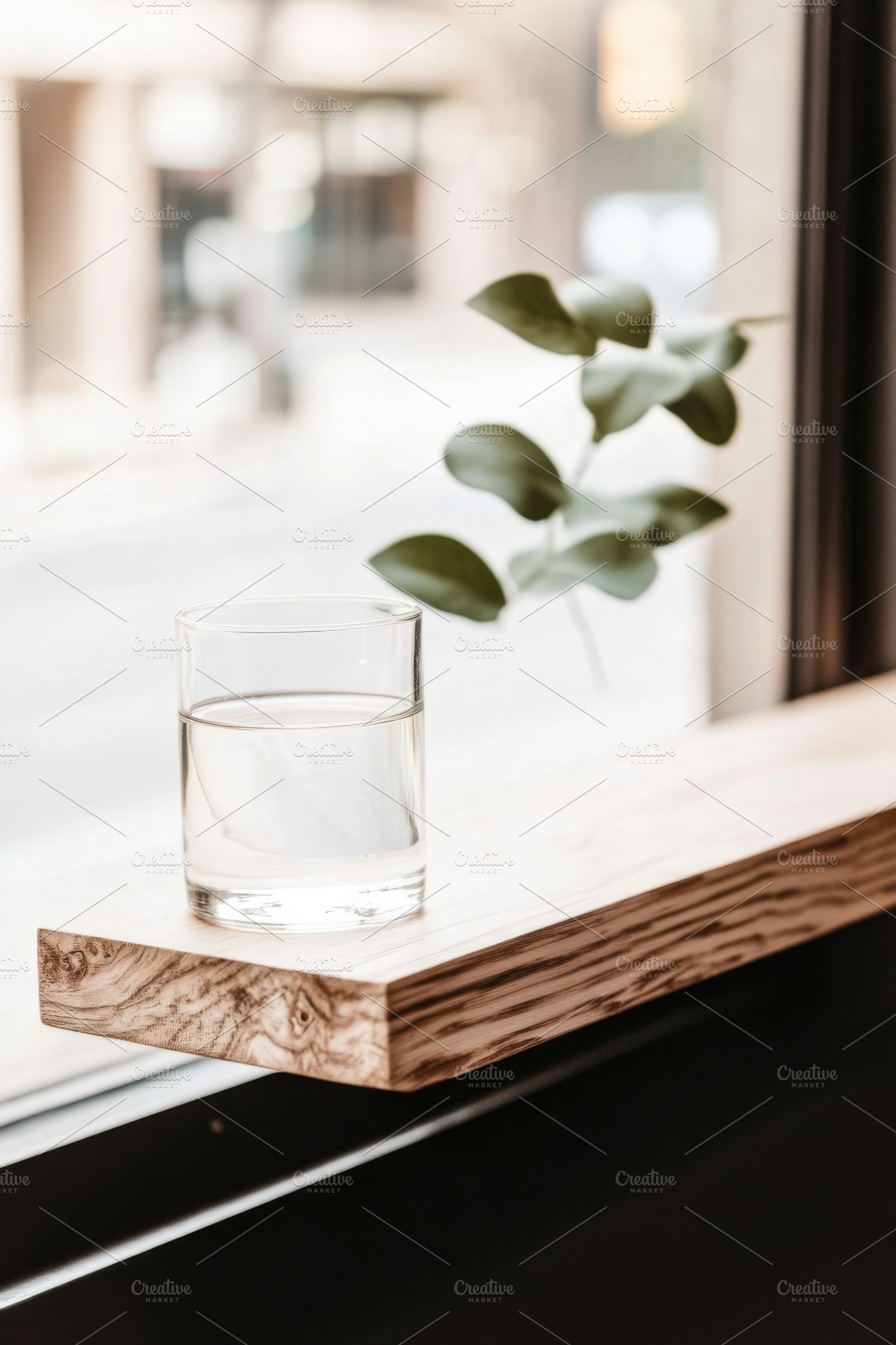 Glass of water on wooden windowsill, a Photo by Dvoevnore photos