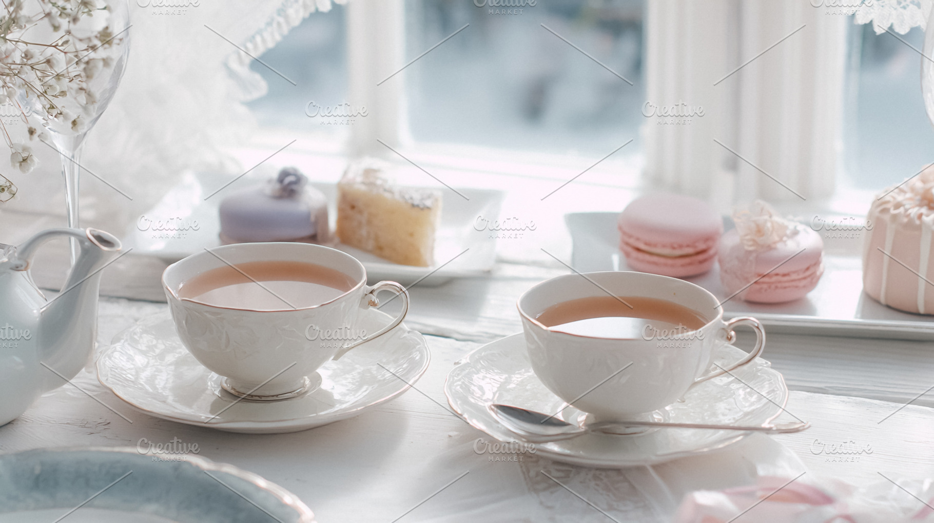 Elegant tea party setting with hot tea in delicate cups and vari, a Photo by Studio ANNA