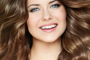 Beautiful young woman with long wavy brown hair, blue eyes and p, a Person Photo by Studio ANNA
