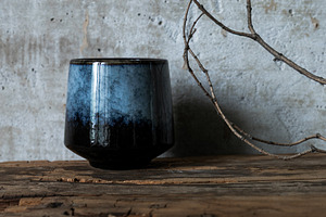 Dark ceramic cup on rustic wood with, an Arts & Entertainment Photo by Edalin's Store