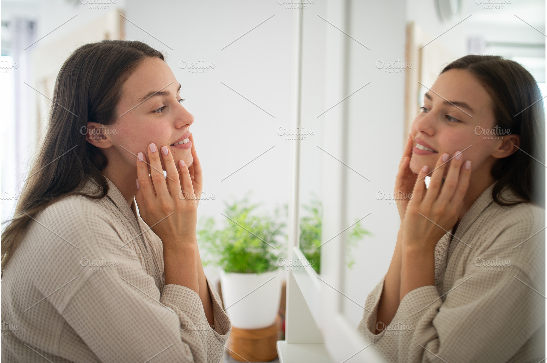 Beautiful woman checking her skin, a Person Photo by HalfPoint