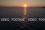 Aerial seascape at sunset, a Graphic by Grey Coast Media (Thumbnail 1 of 2)