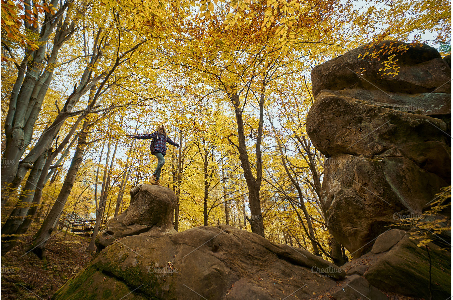 Woman standing on big old boulder in, a Nature Photo by vitaliymateha photography