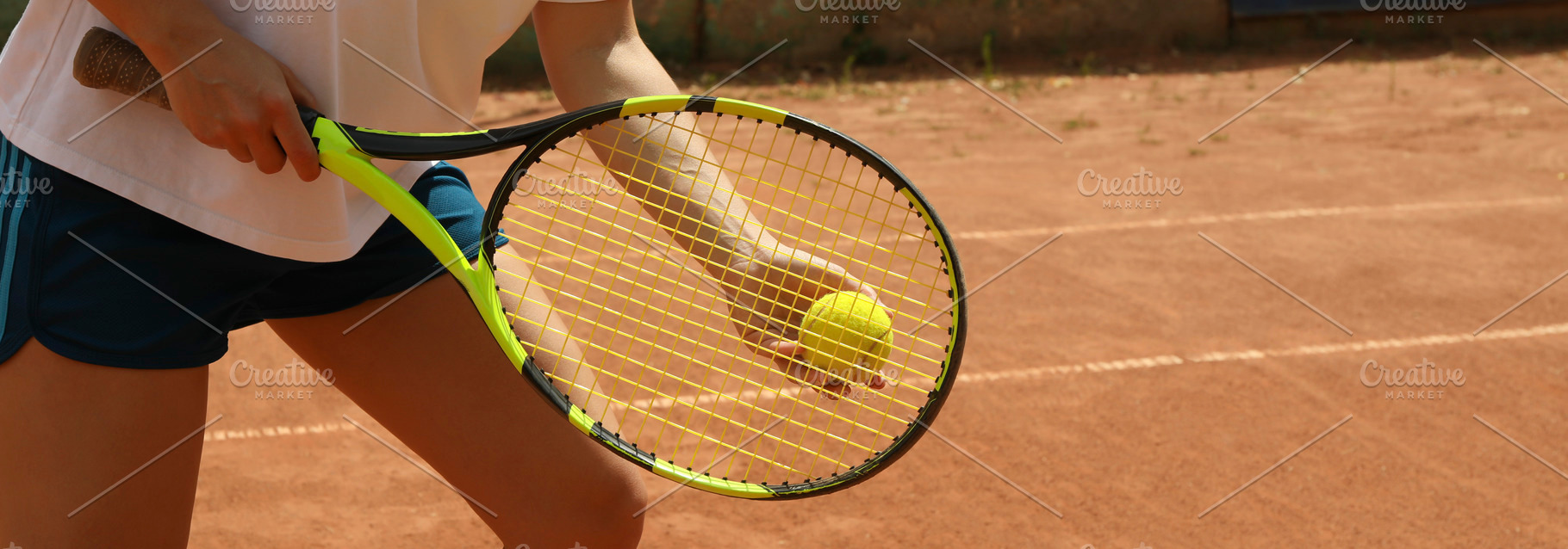 Woman hold racket and tennis ball on clay court, a Sports & Recreation Photo by AtlasStudio PRO