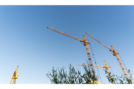 Construction cranes on a blue sky, an Industrial Photo by darksoul72