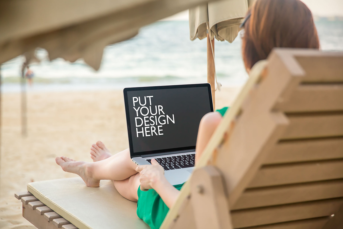 Girl on the Beach with Laptop, a Mac Mockup by UI Kitchen (Photo 3 of 6)