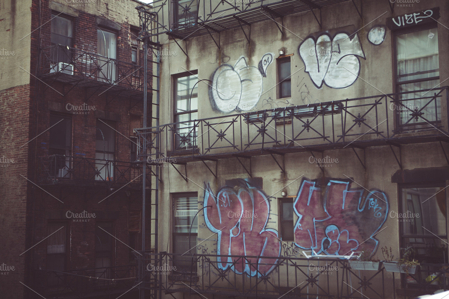 Fire escape graffiti featuring new york, nyc, and ny, an Architecture Photo by North & Beard Ltd