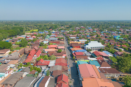 Aerial view of local residential neighborhood roofs. Urban housi