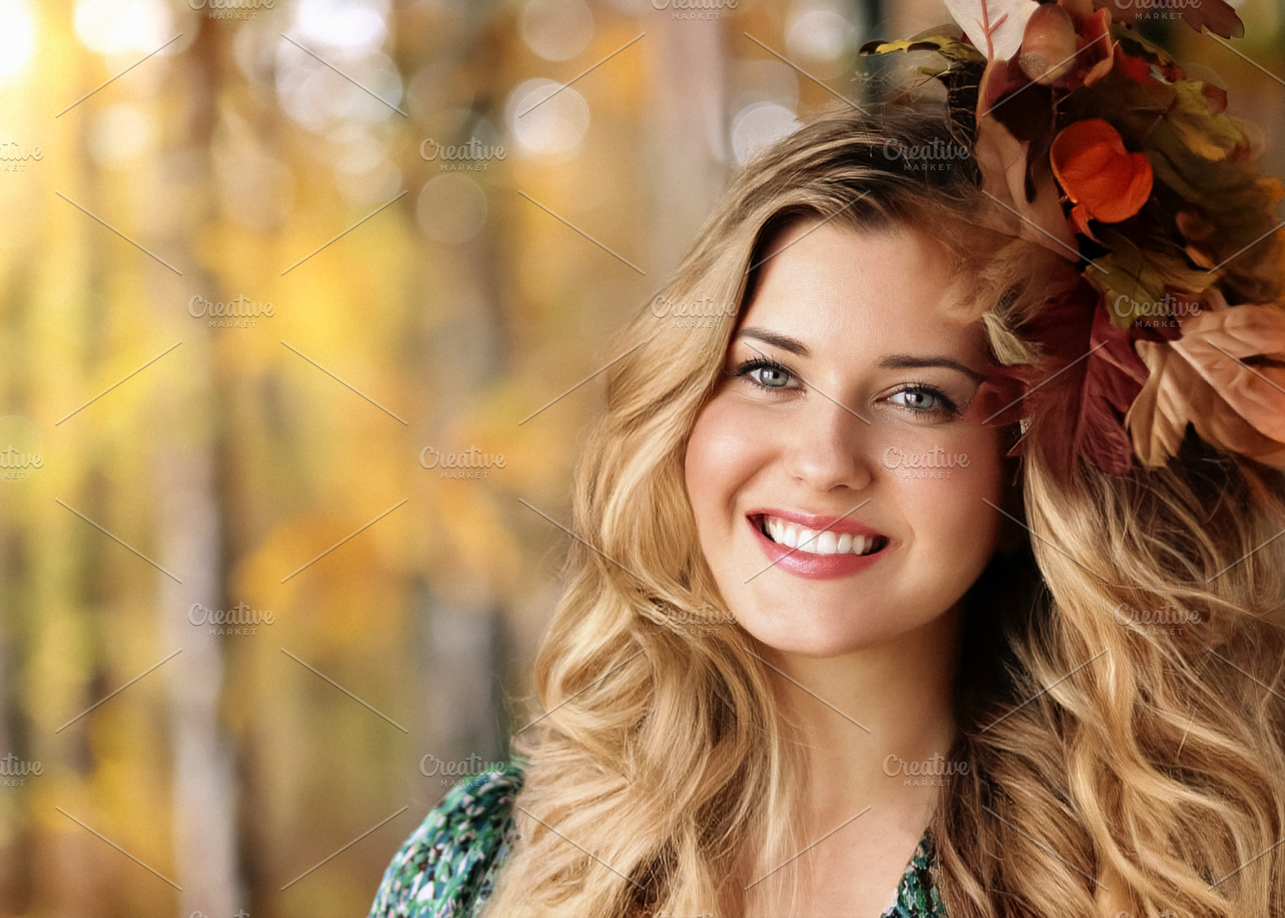Young woman with autumn leaves in her hair smiling, portraying b, a Person Photo by Studio ANNA