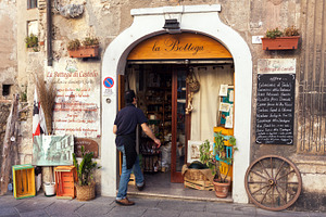 Grocery shop entrance in Italy, a Business Photo by BOOCYS