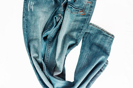 Beautiful casual jeans pants and clothes isolated on white backg, a Beauty & Fashion Photo by TanaCh