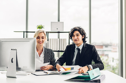 Two professional business man and woman meeting analyzing data a, a Person Photo by Art_Photo