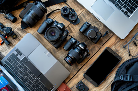 Various photography gear is arranged, a Photo by Tanuart