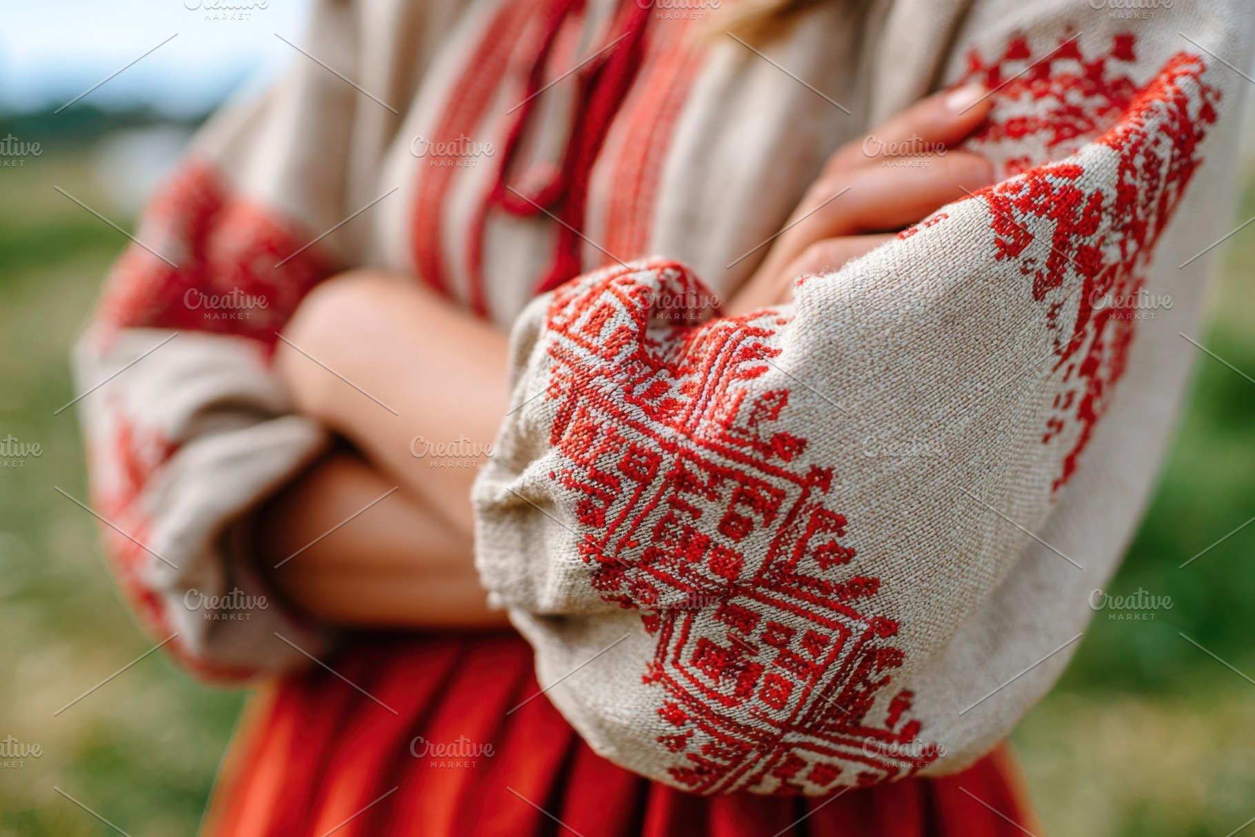 Close-up of child's hand in traditional embroidered shirt, a Person Photo by AlyaAnd