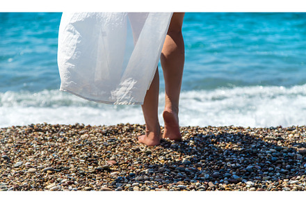 Woman legs on the beach. Selective, a Nature Photo by yanadjana