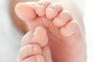 Newborn baby's feet featuring baby, feet, and human