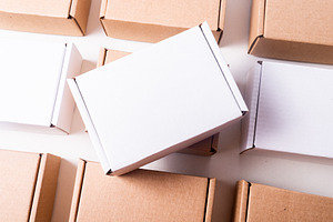 Lot of cardboard box, brown and white, mockup, a Photo by MDBildes