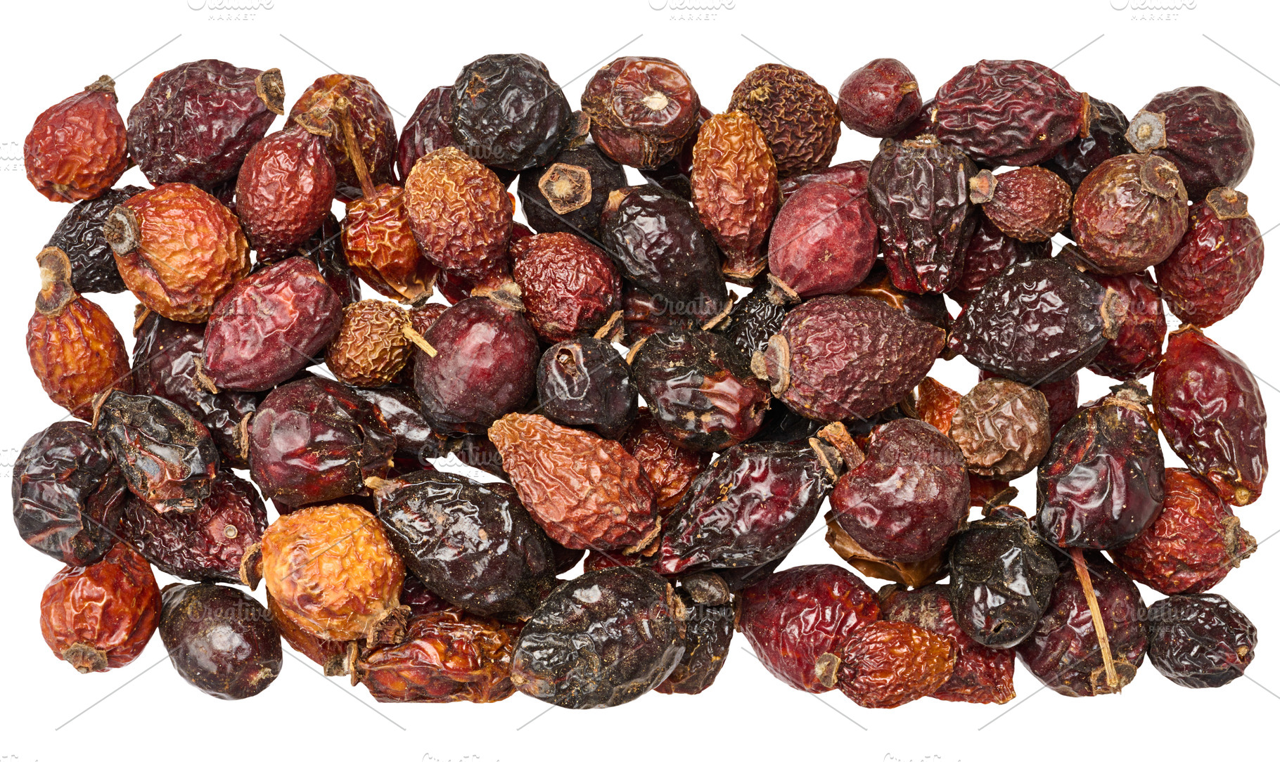 Scattering of dried rosehip fruits with wrinkled skin texture, i, a Food & Drink Photo by ndanko