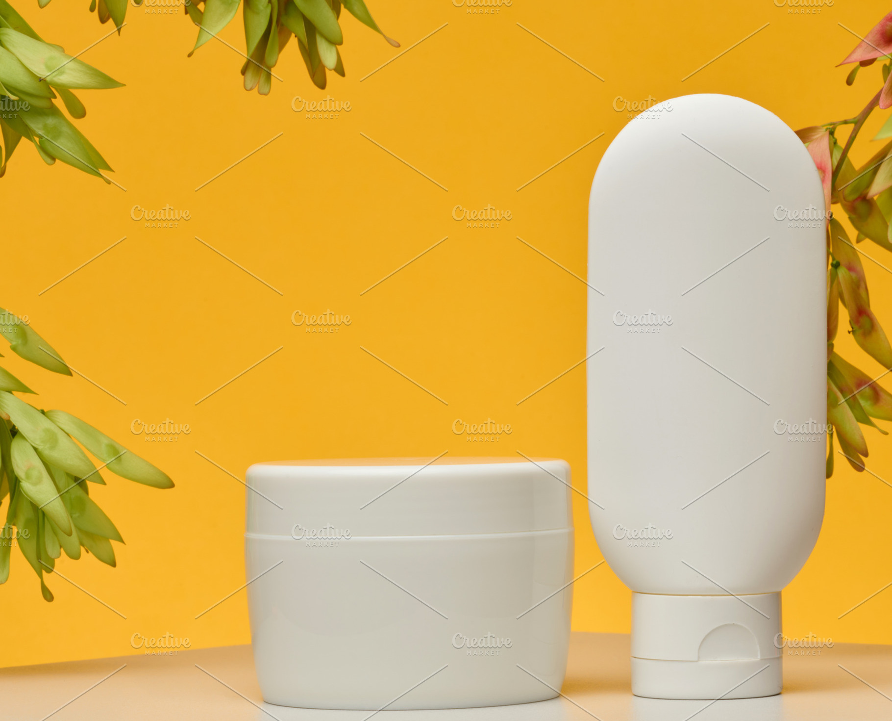 Cosmetic products without labels tube, flat round jar, stand on, a Beauty & Fashion Photo by ndanko
