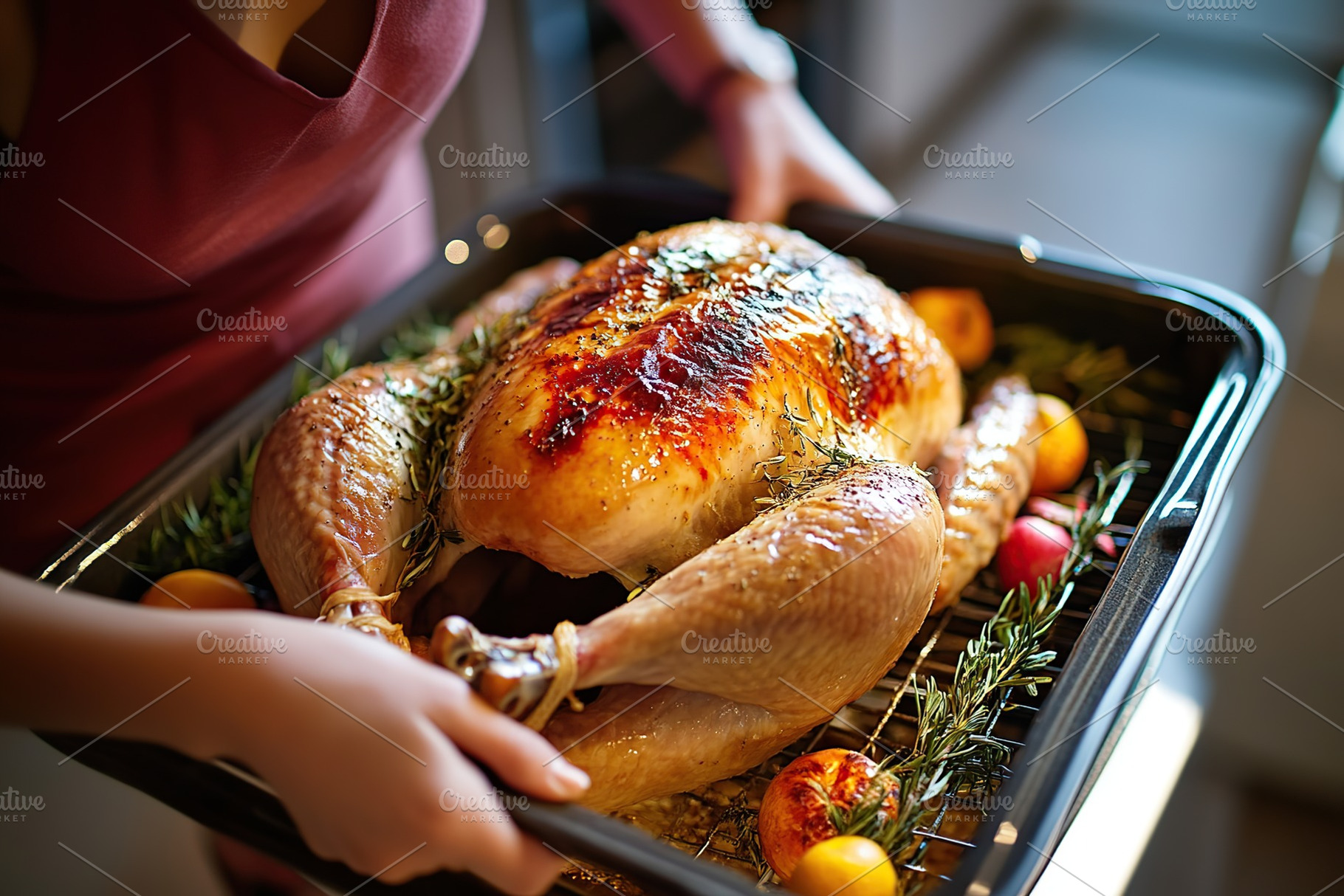 Housewife taking roasted turkey on tray from the oven. Thanksgiving day, a Food & Drink Photo by AlyaAnd