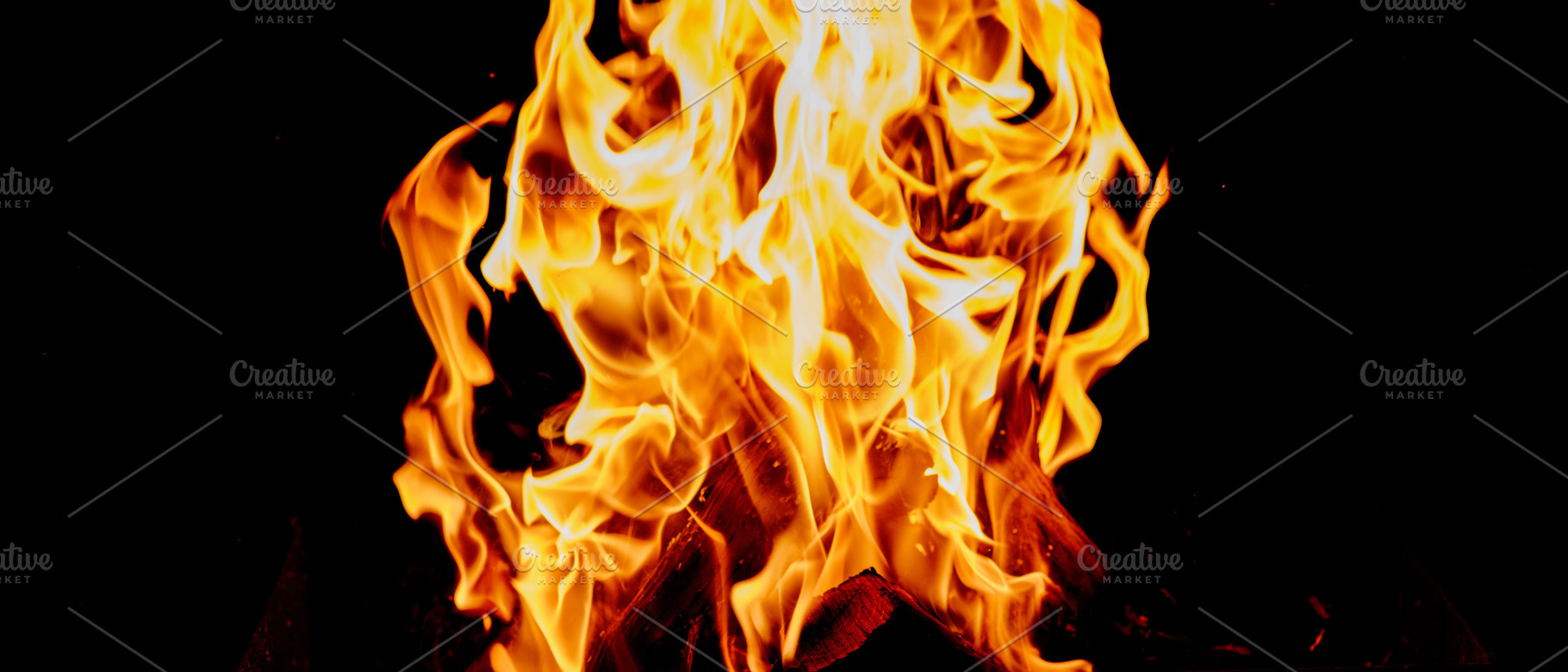 Close-up of tall bright flames, tongues of fire and orange-yello, a Background Photo by ndanko