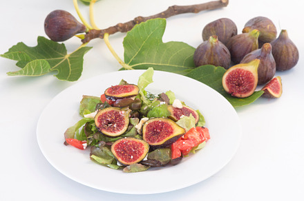 Salad with fig, cheese and tomato, a Background Photo by DalaiFood
