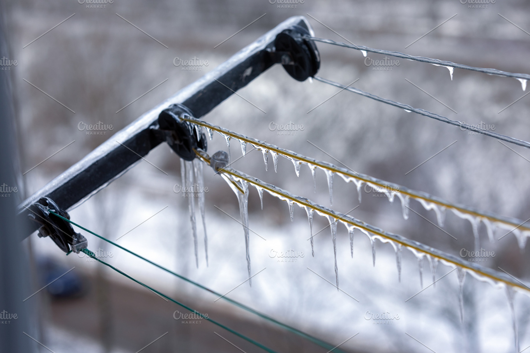 Power lines covered in icicles during cold winter, with a snowy,, a Background Photo by Ales Munt