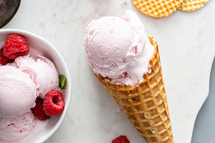 Raspberry ice cream in a bowl and conw with fresh berries, a Food & Drink Photo by farwasser