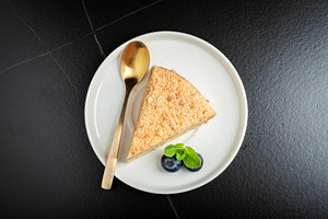 Medovik. Honey cake made from honey cakes with whipped sour cream, decorated wi, a Food & Drink Photo by Budarinphoto