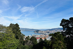 Panoramic view of Vigo cityscape and harbor surrounded by lush greenery, Spain, a Photo by AS photostudio