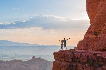 Silhouette of father and his daughter on the trail at Cathedral Rock at sunset, a Person Photo by travnikovstudio
