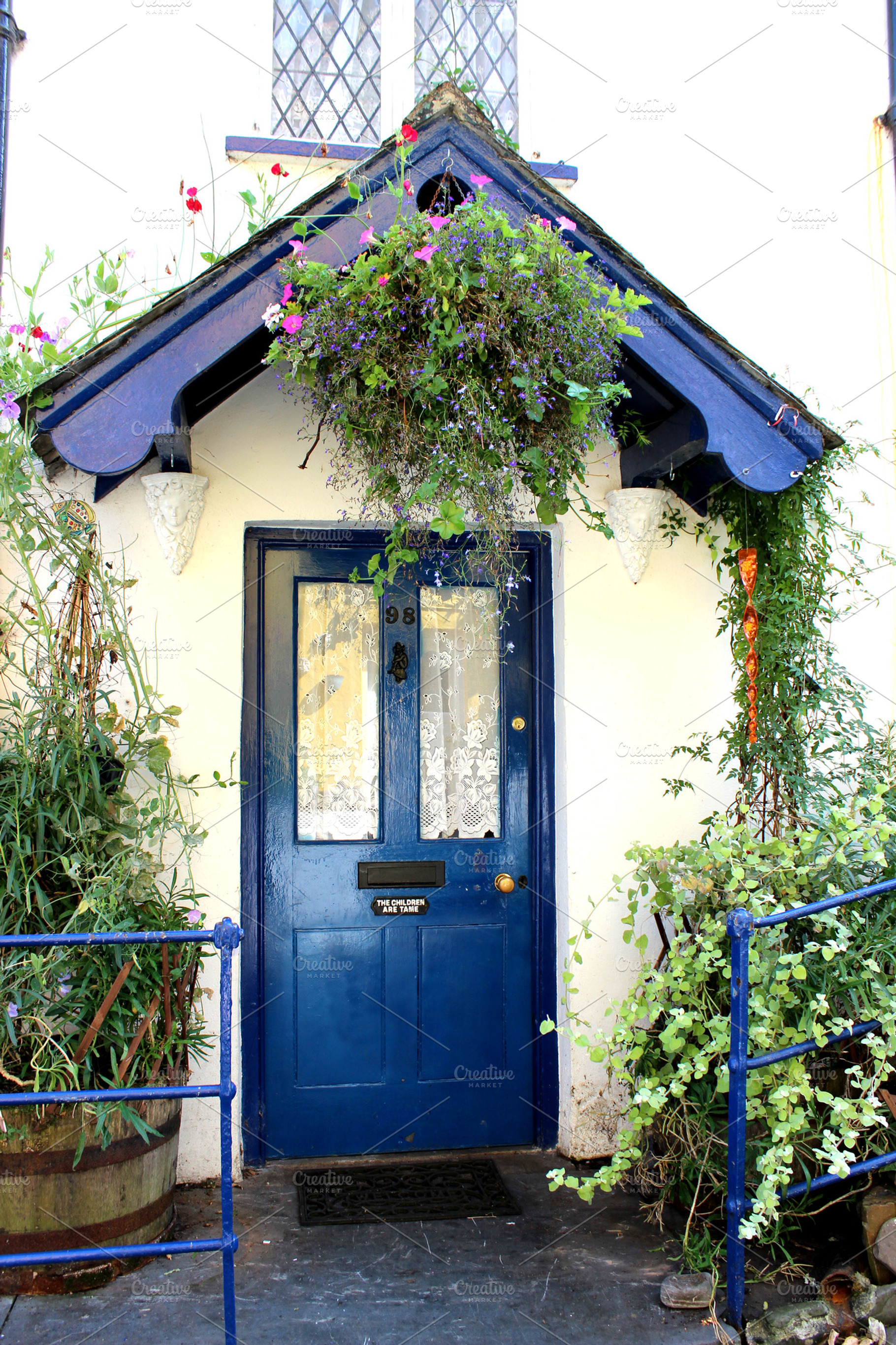 Blue Front Door of Cottage, a Photo by Corner Croft Mockups
