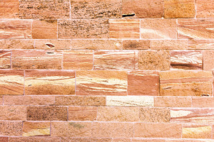 Textured red stone wall background, an Abstract Photo by BOOCYS