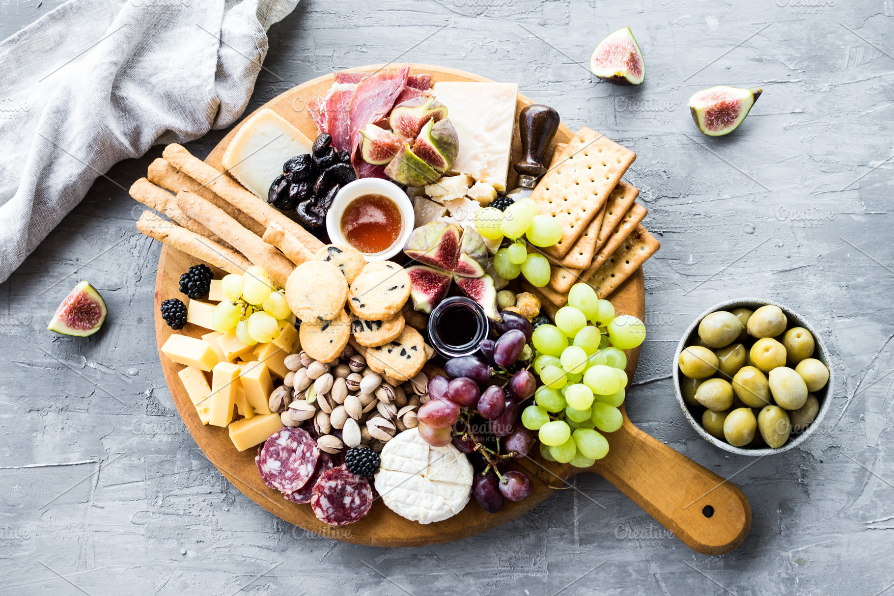 Assortment of tasty appetizers or containing charcuterie, cheese, and platter, a Food & Drink Photo by NelliKovalchuk