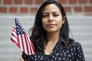 Young Woman Holding a Small American Flag Outdoors, an Abstract Photo by Natalia Klenova's Shop